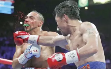  ?? AFP ?? KEITH Thurman (left) believes the rematch between Manny Pacquiao (right) and Floyd Mayweather is just a cash grab.