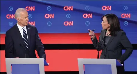  ?? GETTY IMAGES ?? ‘GO EASY ON ME, KID’: Democratic presidenti­al candidates former Vice President Joe Biden and California U.S. Sen. Kamala Harris speak during the second round of the second Democratic debate in Detroit on Wednesday.