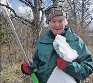  ??  ?? Dog walker Maureen Mair was out on Saturday and Sunday doing her bit along the Black Lynn to Keep Oban Beautiful.