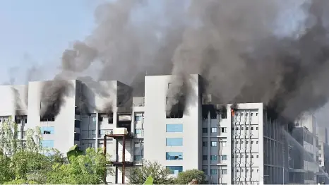  ?? Picture: AFP ?? TOWERING INFERNO. Smoke rises after a fire breaks out at the Serum Institute of India in Pune yesterday. The institute is the world’s largest maker of vaccines. Media reports say production of the Covid-19 vaccine is not affected.