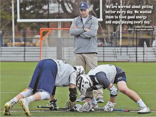  ??  ?? STAFF PHOTOS BY PATRICK WHITTEMORE BUILDING BLOCKS: Saint John’s Prep lacrosse coach John Pynchon works with Ethan Barnard (left) and Craig Yannone on their faceoff skills last week.