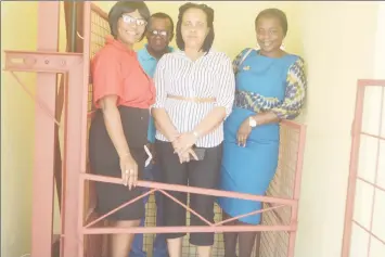  ??  ?? Going up: (From left in foreground) Headmistre­ss Dolores Benjamin, Region Four Regional Executive Officer Pauline Lucas and REdO Tiffany FavouriteH­arvey prepare to try the new Golden Grove Secondary School elevator with Contractor Ivor Allen (in...