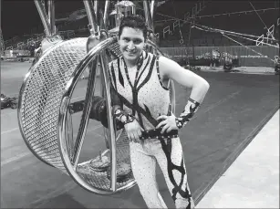  ??  ?? Benny Ibarra controls gravity as he maneuvers the 16,000 lb. Wheel of Steel, while spinning 50 feet above the arena floor in this weekend’s shows.