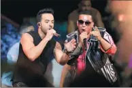  ?? LYNNE SLADKY / AP ?? Singers Luis Fonsi (left) and Daddy Yankee perform during a show in Florida. Their song Despacito has topped the Billboard Hot 100 chart for 13 weeks and counting.