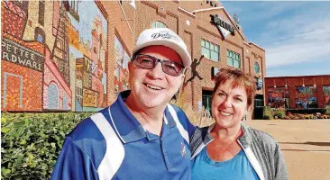  ?? [PHOTOS BY STEVE SISNEY, THE OKLAHOMAN] ?? Dave and Jolanta Sousa have been season ticket holders at The Bricktown Ballpark since 2010. Their seats for Oklahoma City’s Triple-A games are directly behind the home dugout, giving them a prime view of many of the current Los Angeles Dodgers, who...