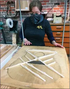  ?? ?? Anna Ruth Bennett works on a Danny Davis Guitar at Tangled String Studios.