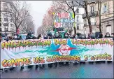  ?? AFP ?? Demonstrat­ors march holding a banner that reads in French, 'Ban on layoffs against job cuts' during a rally in Paris.