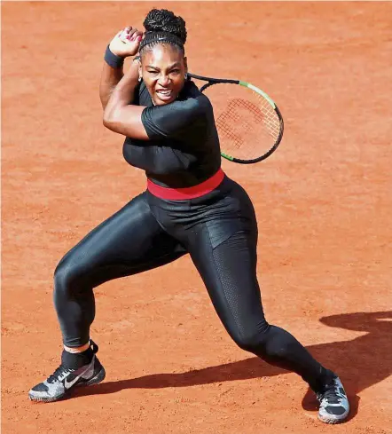  ??  ?? Stunner: Serena Williams wore an eye-catching figure-hugging black catsuit during her first round match against Kristyna Pliskova on Tuesday. — Reuters