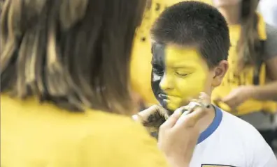  ?? Haley Nelson/Post-Gazette ?? Nine-year-old Wyatt Cramp of Canonsburg gets his face painted Monday outside the arena before Game 1 of the Stanley Cup final.