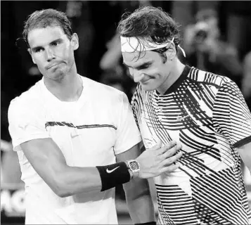  ?? DITA ALANGKARA/AP ?? Though injuries have thinned the U.S. Open field, Rafael Nadal (left) and Roger Federer stand in the way of any upstarts.