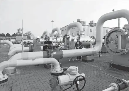  ?? SONG WEIXING / FOR CHINA DAILY ?? Technician­s check pipelines at a gas station in Chuzhou, Anhui province, in February.