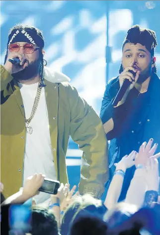  ?? LYLE ASPINALL ?? The Weeknd, right, and Belly shared the 2016 SOCAN Songwriter of the Year award, and both sat out a planned appearance on Jimmy Kimmel’s show to signal opposition to fellow guest Donald Trump.