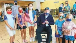  ?? STACEY HALBOTH ?? Veteran Bob Brown with second-grader Jake Harris, fifth-graders Samantha Chaconas and Sloan Harris, and first-graders Dylan and Elizabeth Chaconas.