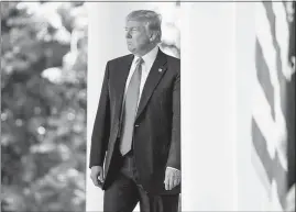  ?? ANDREW HARNIK / AP ?? President Donald Trump arrives June 1 in the Rose Garden of the White House to announce the U.S. would withdraw from the Paris climate change accord. As part of the Brookings Scholar Lecture Series, Brookings Mountain West is sponsoring a lecture...