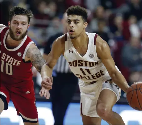  ?? AP ?? LOOKING TO DRIVE: Boston College’s Derryck Thornton drives past North Carolina State’s Braxton Beverly on Sunday night.