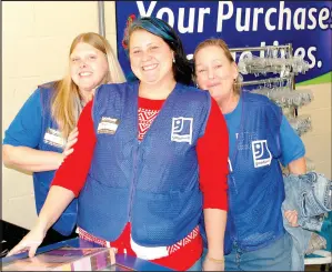  ?? Marc Hayot/Herald Leader ?? Despite being busy, the associates at Goodwill said they are excited to be back. Pictured are employees Toni Chambers (left), Megan Dietrich and Diane Johnson.