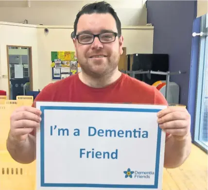  ??  ?? Student Robat Owen who is currently studying an Access to Higher Education in Health Care course, recently completed training with the Alzheimer’s Society to become a ‘Dementia Friends Champion.’ Robat, from Bethesda, is now busy raising awareness...