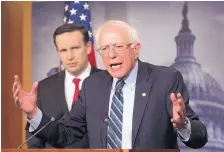  ?? J. SCOTT APPLEWHITE/ASSOCIATED PRESS ?? Sen. Bernie Sanders, I-Vt., joined at left by Sen. Chris Murphy, D-Conn., speaks at a news conference Thursday at the Capitol after the Senate passed a resolution on the Saudi-led war in Yemen.