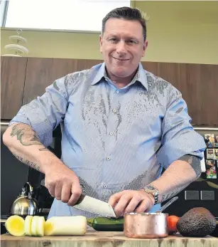  ?? PHOTO: GREGOR RICHARDSON ?? Greg Piner whips up dinner in the kitchen of his Dunedin home.