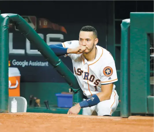  ?? PHOTO D’ARCHIVES, AFP ?? Carlos Correa, des Astros, semblait songeur à la suite de l’éliminatio­n de son équipe, jeudi soir, aux mains des Red Sox de Boston.