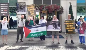  ?? ?? Activists outside the Powerscour­t Hotel, Enniskerry, in a recent protest calling for the Dialog conference to be cancelled. Photo: Instagram