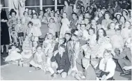  ?? Photo: ALEXANDER TURNBULL LIBRARY 114/403/01-G ?? Company Christmas: The Evening Post children’s Christmas party was a popular event of the season for the paper’s families.