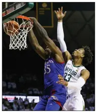  ?? (AP/Ray Carlin) ?? Kansas center Udoka Azubuike (35) dunks the ball in front of Baylor forward Freddie Gillespie during the No. 3 Jayhawks’ 64-61 victory over the top-ranked Bears on Saturday in Waco, Texas.