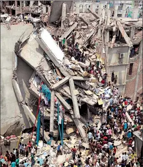  ?? AP/A.M. AHAD ?? Rescuers work in the rubble of a collapsed building Wednesday in Savar, Bangladesh.
