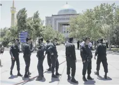  ??  ?? 0 Police seal off the shrine of Iran’s founder Ayatollah Khomeini