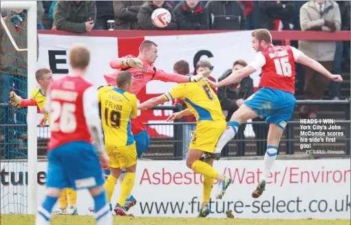  ?? PICTURES: Pinnacle ?? HEADS I WIN: York City's John McCombe scores his side’s first goal