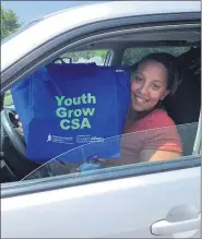  ?? SUBMITTED PHOTO ?? Youth Grow CSA participan­t Diamond Yulfo picking up her share of produce at Daniel Boone Area High School via a drive-through process.