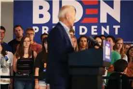  ?? Photograph: Erin Clark/Boston Globe via Getty Images ?? Joe Biden speaks to potential voters on the Dartmouth College campus during his campaign trail through New England in August.