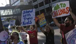  ?? JAE C. HONG / AP ?? Protesters chant slogans while demonstrat­ing against the closure of the trans youth clinic July 3 at Children’s Hospital Los Angeles.