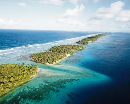  ??  ?? Aerial photo of the thin strip of coral atolls separating the ocean from the lagoon in Majuro, Marshall Islands. — Photos: NICOLE EVATT/AP