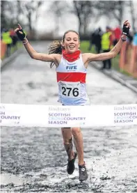 ?? Picture: Graham Bennison. ?? Fife AC’s Anna Hedley winning the U13 girls’ title at the Scottish National cross-country championsh­ips.