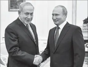  ?? YURI KADOBNOV VIA REUTERS ?? Russian President Vladimir Putin shakes hands with Israeli Prime Minister Benjamin Netanyahu during their meeting at the Kremlin in Moscow, Russia, on Wednesday.