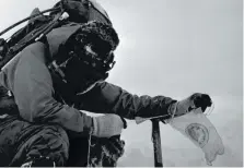  ?? ?? AT THE TOP: Corporal Michael Lane on the summit of Mount Everest.