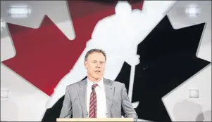  ?? CP PHOTO ?? Sean Burke, who will serve as general manager of Team Canada in 2017-18, announces former Vancouver Canucks head coach Willie Desjardins will be Team Canada’s head coach at a news conference in Calgary, Alta., Tuesday.