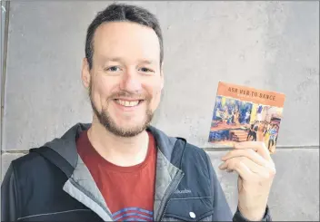  ?? SALLY COLE/THE GUARDIAN ?? P.E.I. fiddler Ward MacDonald displays his new CD, “Ask Her to Dance.” He launched the debut album this past Wednesday at a P.E.I. Mutual Festival of Small Halls concert at the Olde Lorne Valley School.