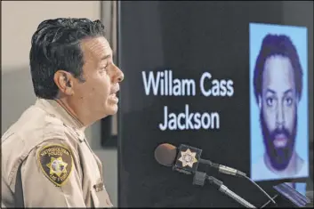  ?? Bizuayehu Tesfaye Las Vegas Review-Journal @bizutesfay­e ?? A photo of suspect William Cass Jackson, 32, is displayed Friday as Clark County Assistant Sheriff Brett Zimmerman gives a briefing on a shooting at a credit union.