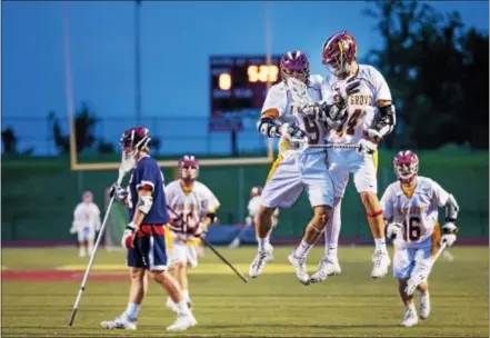  ?? NATE HECKENBERG­ER — FOR DIGITAL FIRST MEDIA ?? Avon Grove’s Scooter Whiteside (9) celebrates his second goal of the game with teammate Brendan Harman (14), early in the third quarter Tuesday night against Central Bucks East.