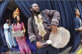  ?? HYOSUB SHIN / HSHIN@AJC.COM ?? African drummers perform as students arrive at Movie Tavern Northlake to watch “Black Panther”on Tuesday. More than 700 DeKalb County School District and Atlanta Public Schools students attended the event.