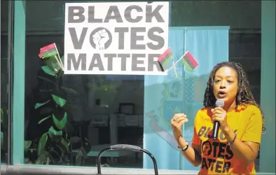  ?? Matthew Brown / Hearst Connecticu­t Media ?? Stamford native Doris Walden speaks to hundreds gathered in front of the Stamford Government Center to hold a Black Votes Matter Rally on Saturday in Stamford.