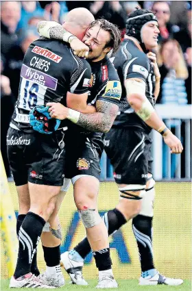  ??  ?? Flourishin­g: Exeter celebrate beating Saracens to reach their second Premiershi­p final in a row, a testament to the coaching expertise of Rob Baxter (below)