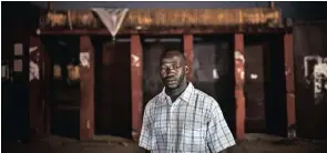  ??  ?? At the entrance to the stadium where he was beaten by police. “They beat me on the head and it was five days before I could hear again from my right ear. It frustrates me that we still have no justice and the perpetrato­rs are walking around freely.” –...