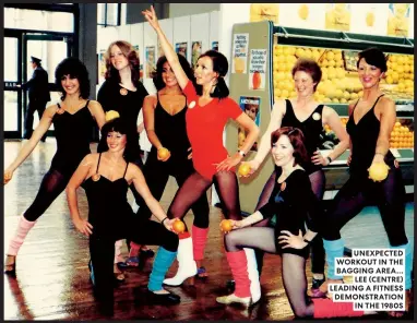  ??  ?? UNEXPECTED WORKOUT IN THE BAGGING AREA… LEE (CENTRE) LEADING A FITNESS DEMONSTRAT­ION IN THE 1980S