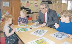  ?? JIM DAY/TC MEDIA ?? Education, Early Learning and Culture Minister Doug Currie enjoys some playtime at Milestones Early Learning Centre in Stratford with, from left, four-year-olds Eve McGuigan, Tallulah Crooks and Cooper Richards. The minister took part in an...