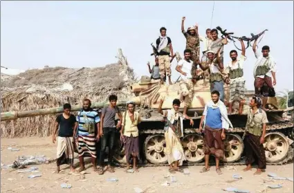  ?? PICTURE: REUTERS ?? Tribal fighters loyal to the Yemeni government stand by a tank in the al-Faza area near Hodeida, Yemen, on June 1.