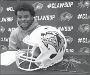  ?? NWA Democrat-Gazette/FLIP PUTTHOFF ?? Jadon Jackson, a student at Bentonvill­e West High School, signed Wednesday a letter of intent to play football for Ole Miss.