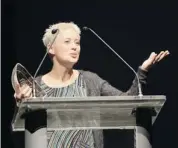  ??  ?? Helen Austin from Vancouver Island accepts her award for Children’s Album of the Year for Always Be A Unicorn during the Canadian Folk Music Awards on Sunday. Alberta artists failed to take home any awards.